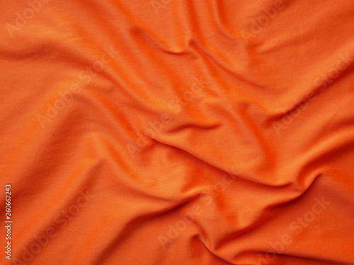 orange sportswear shirt background,silk cloth texture