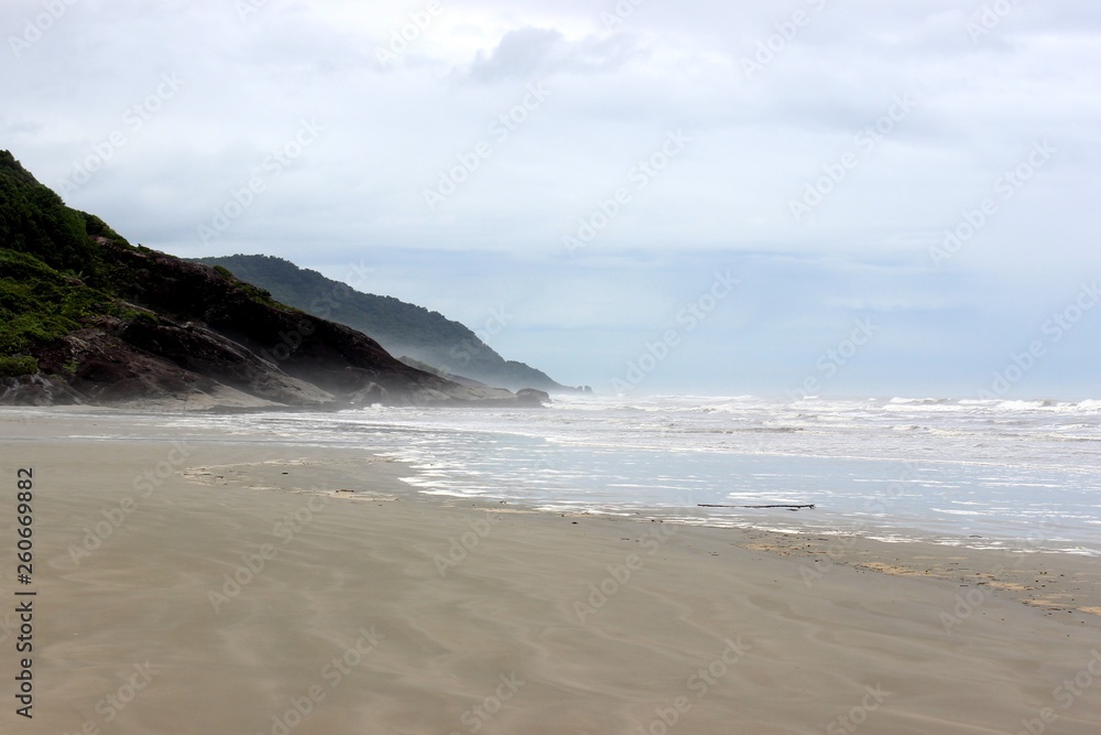 Cloudy day landscape at the beach of Barra do Una, located at Juréia-Itatins Ecological Station, Peruíbe, São Paulo, Brazil. Cloudy day landscape at the beach of Barra do Una, located at Juréia-Itatins Ecological Station, Peruíbe, São Paulo, Brazil.