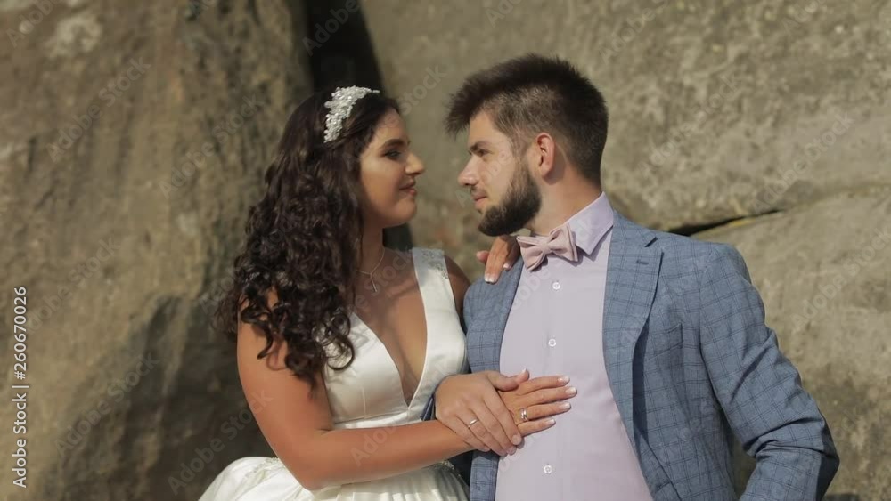 Groom with bride near mountain hills. Wedding couple. Happy family in love Groom with bride near mountain hills. Wedding couple. Happy family in love