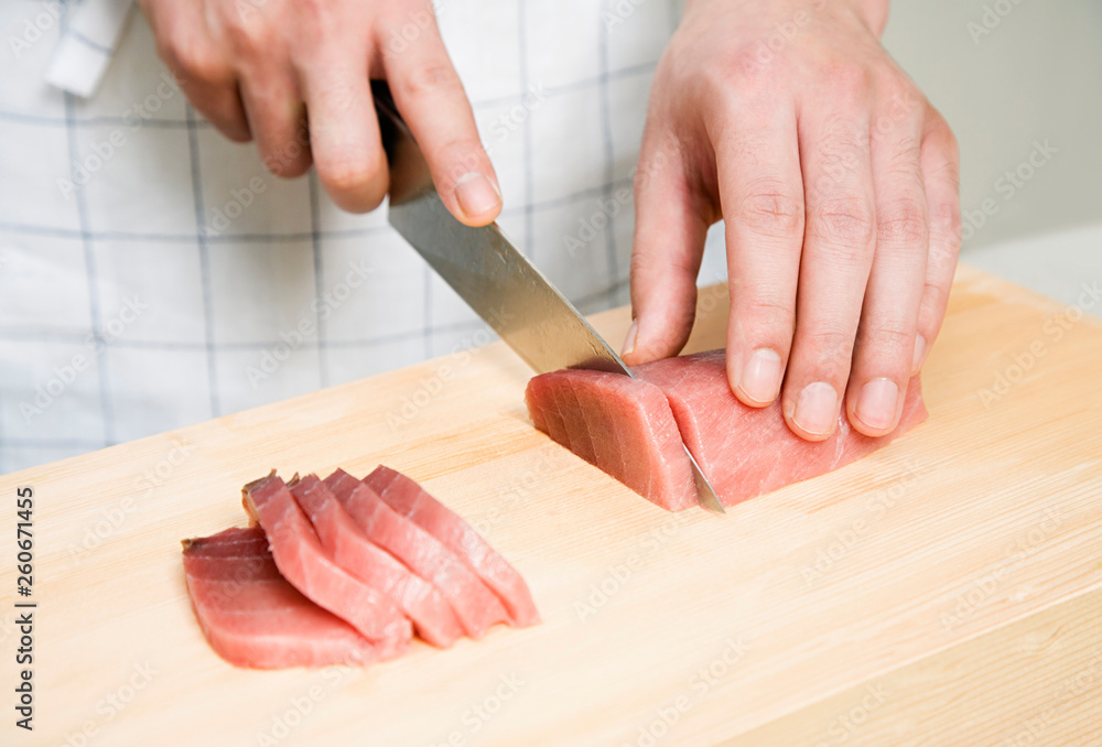 Person Preparing Sashimi