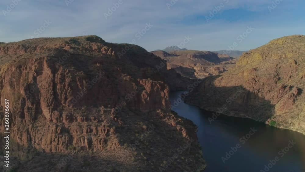 AERIAL - Drone Pan of Narrow Waterway in Between Mountains AERIAL - Drone Pan of Narrow Waterway in Between Mountains