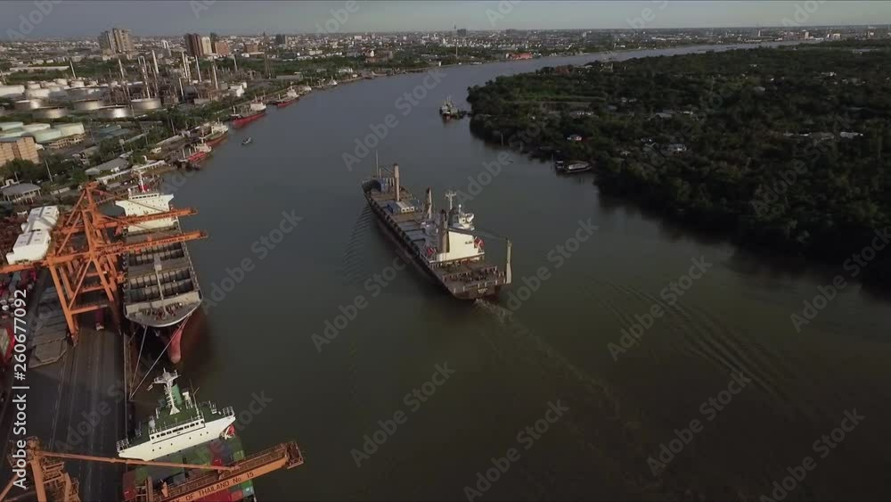 Logistic concept aerial View of maritime transport commercial dockyard with cargo ships, containers waiting to be Upload and Offload Cargo Containers Logistic concept aerial View of maritime transport commercial dockyard with cargo ships, containers waiting to be Upload and Offload Cargo Containers