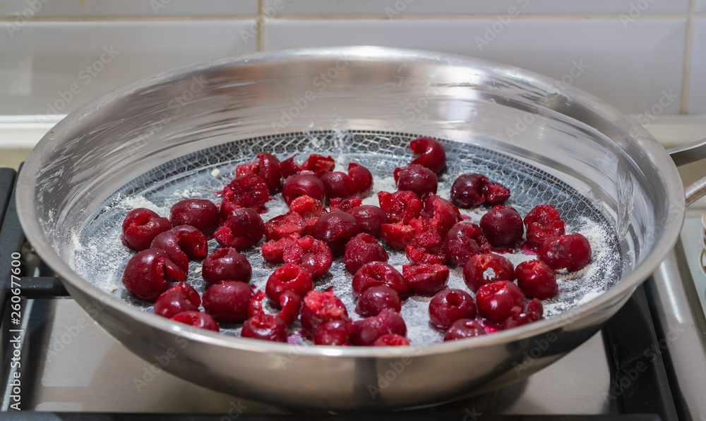 cherries in a skillet, ingredients for a pie cherries in a skillet, ingredients for a pie