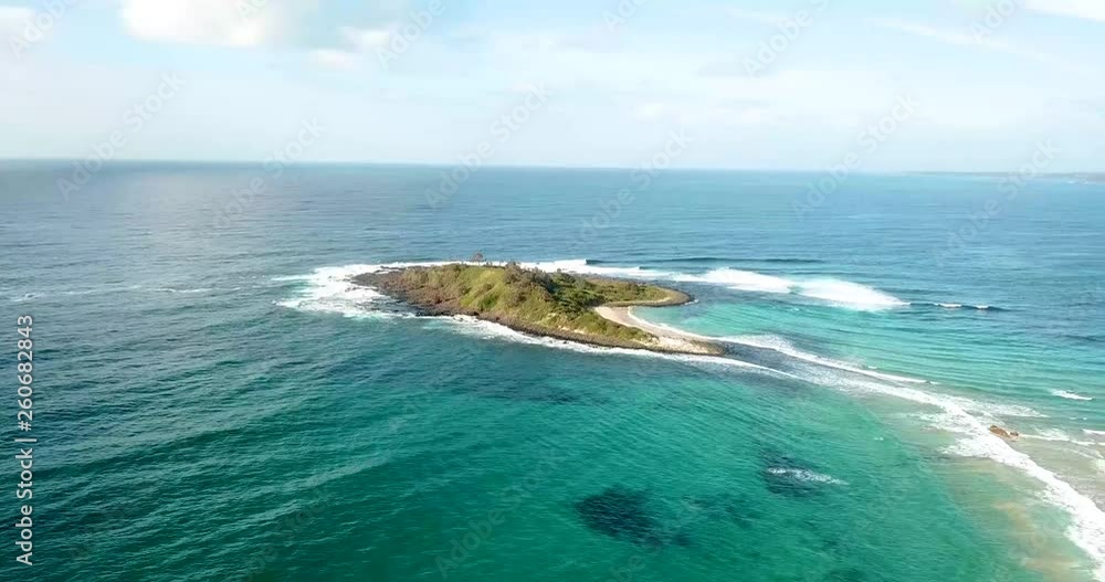 Drone shot over Green Island, Australia. Hovering over ocean heading towards island. Drone shot over Green Island, Australia. Hovering over ocean heading towards island.