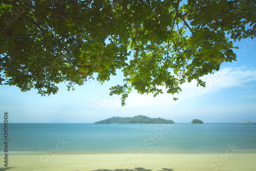 Serenity panorama view under the tree at the beach. Slow shutter. © jakHafiz