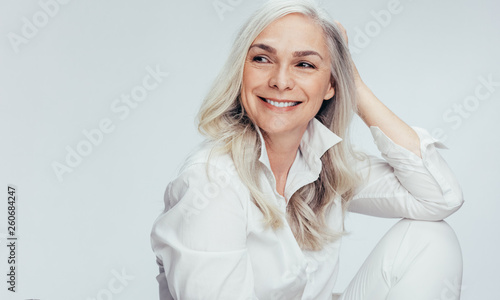 Beautiful senior woman looking at copy space