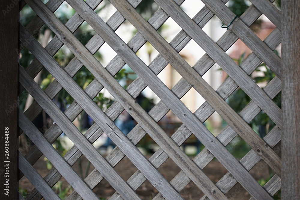 Garden wooden fence in the daytime Garden wooden fence in the daytime