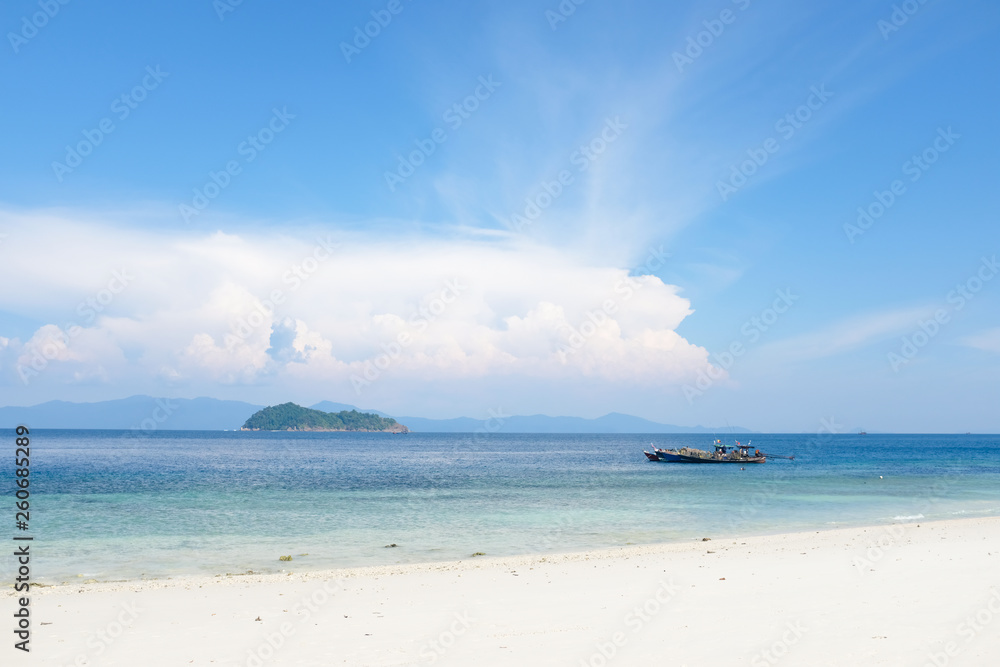 Tropical sand beach island and crystal clear sea water in sunny day. Vacation and holiday in paradise island. Tropical sand beach island and crystal clear sea water in sunny day. Vacation and holiday in paradise island.