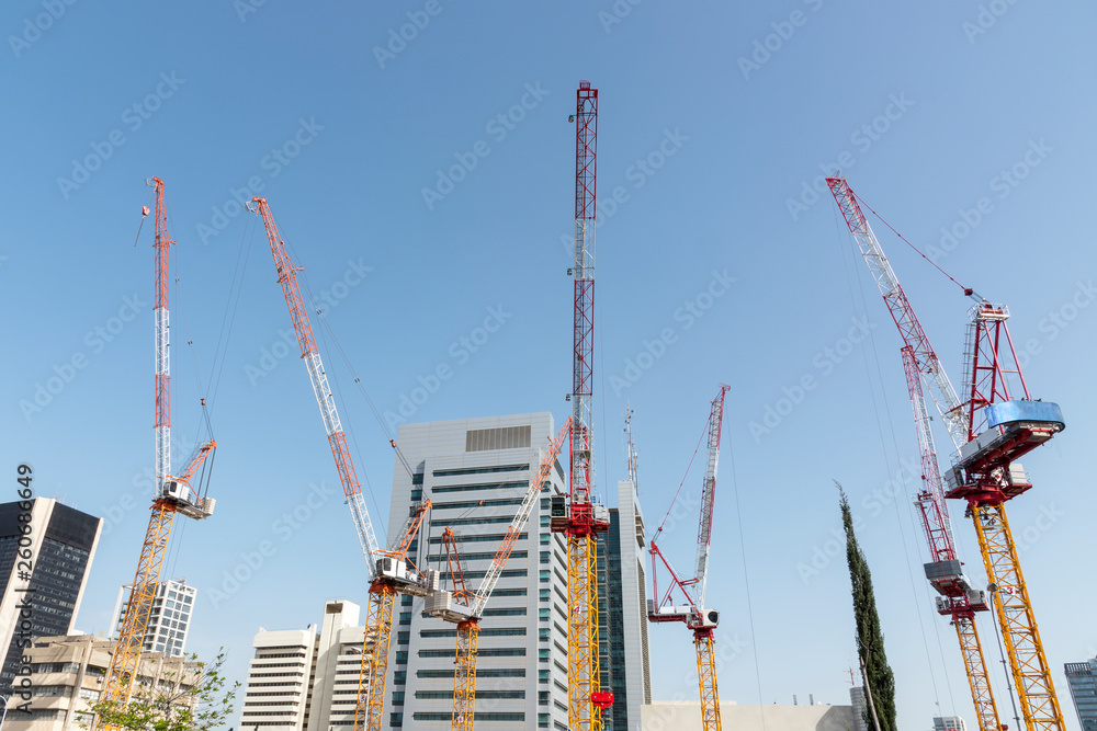 Construction: High-rise buildings and construction cranes in Tel Aviv, Israel