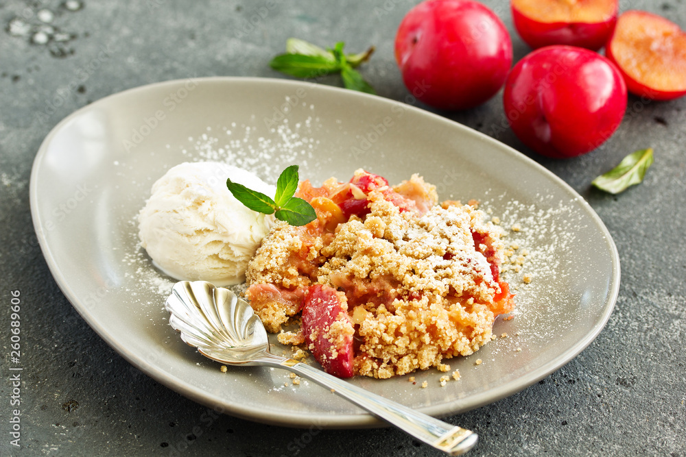 Plum crumble with almond crumb and ice cream. Plum crumble with almond crumb and ice cream.