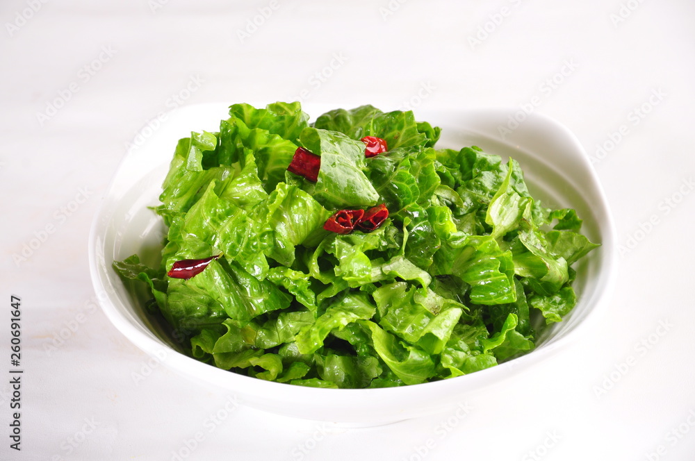 fresh green salad in a bowl isolated on white fresh green salad in a bowl isolated on white
