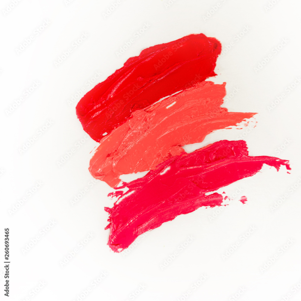 Lipstick and lip gloss, drops and strokes of different shades to create different images in makeup