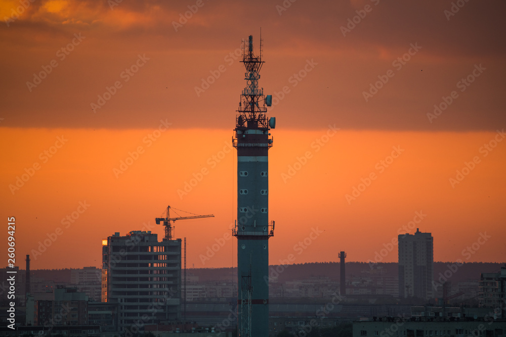 Ekaterinburg, Russia - Jule, 2018: Telephoto lens shot of cityscape view megalopolis during sunset at summer evening