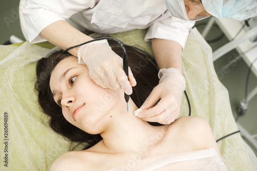 Tableau sur toile Medical treatment removal of birthmark from female patient's neck