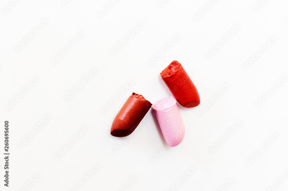 colored pieces of lipstick isolate on a white background