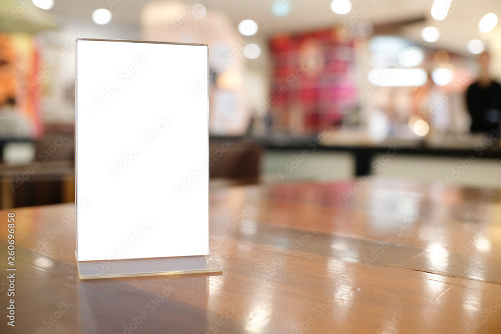 Menu frame space for text marketing promotion standing on wood table in Bar restaurant cafeใ Menu frame space for text marketing promotion standing on wood table in Bar restaurant cafeใ