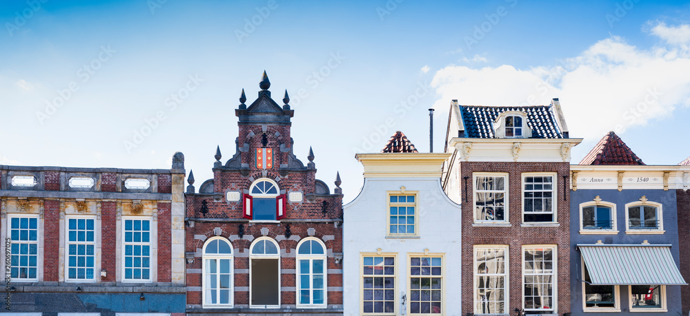 stepped gable houses on market square in Goud, The Netherlands. Banner