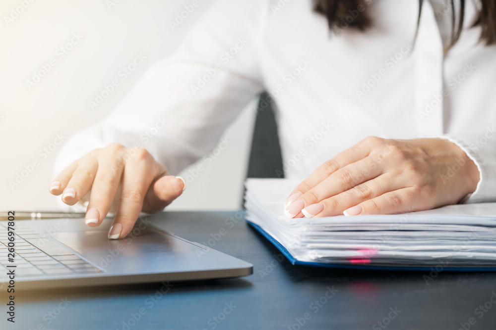 Fototapeta premium Woman working at office hand on keyboard close up