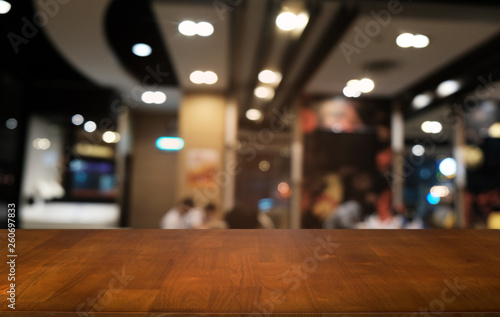 Wallpaper Mural Empty dark wooden table in front of abstract blurred bokeh background of restaurant . can be used for display or montage your products.Mock up for space. Torontodigital.ca