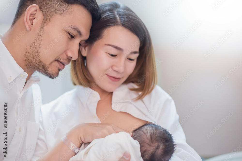 Asian parents newborn baby being breastfeeding, Portrait of asian young