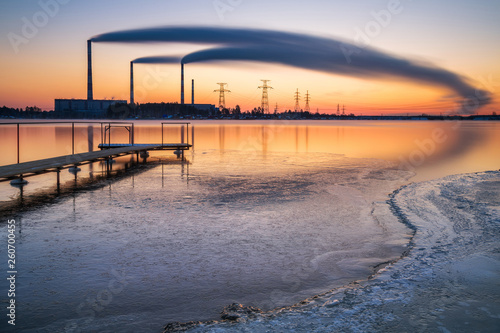 Peftinskiy  Russia - March  2018  Long exposure shot of the view of the hydropower plant from the shore of the lake in the spring morning