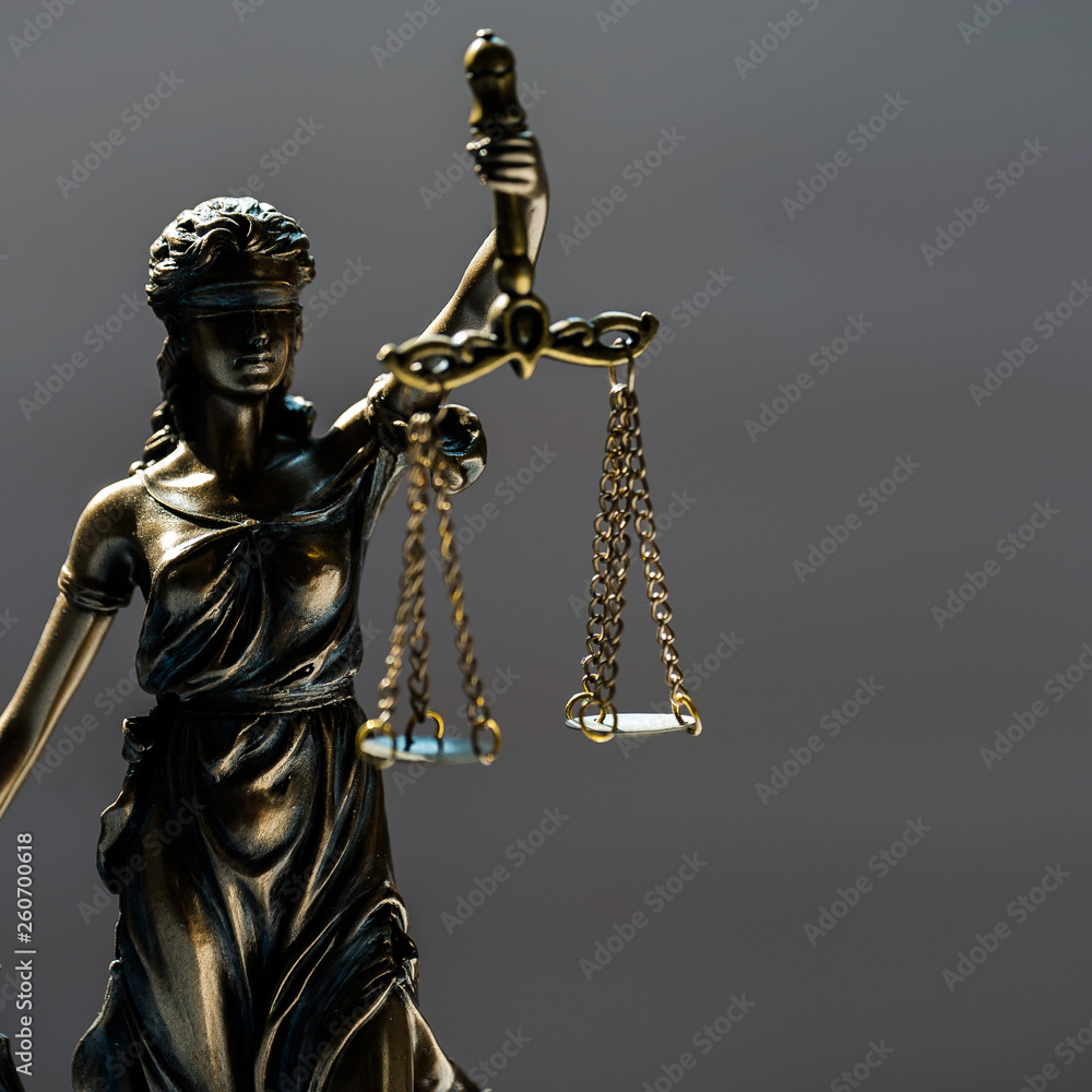 Statue of blind goddess Themis on blurred background Statue of blind goddess Themis on blurred background