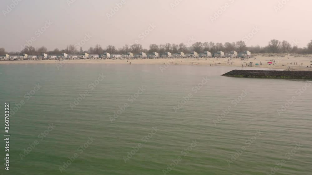 Aerial: Harbour and vacation park during hazy spring day. Aerial: Harbour and vacation park during hazy spring day.