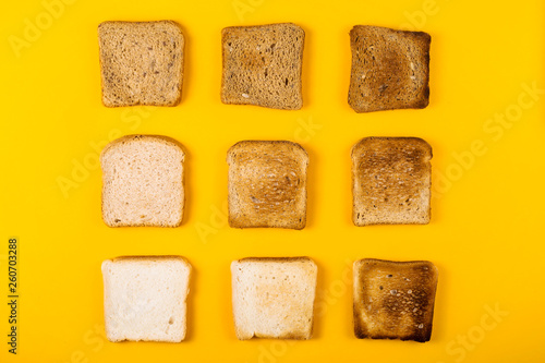 A selection of toast bread for breakfast. Minimalism on yellow