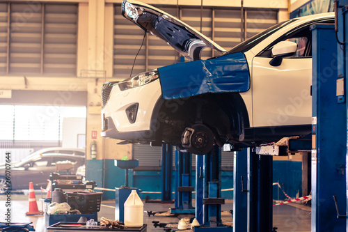 Photos BANGSAN THAILAND 2019This car mazda cx 5 brand japan waiting for repair on car Lift in garage on room customer parked in showroom of thailand for Illustrative editorial image