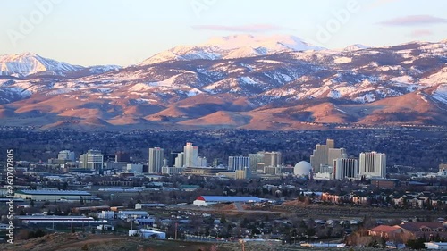 Reno Nevada time lapse of sun rising across mountains and city golden hour