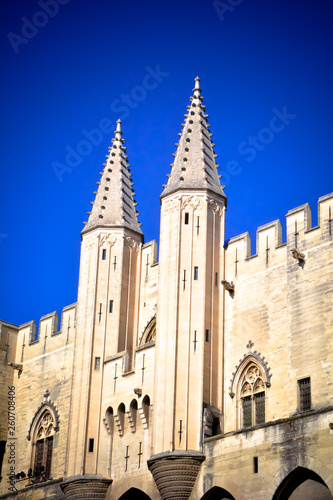 Statue on the top of the Palace of the Popes, Avignon (France) - historical palace located in Avignon, Southern France