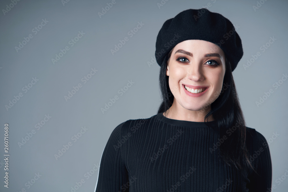 Portrait of smiling brunette girl in beret Portrait of smiling brunette girl in beret