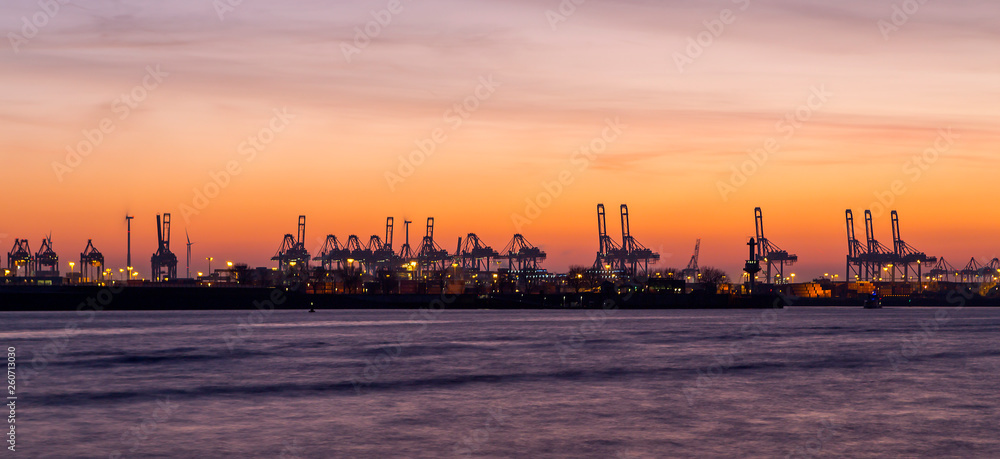 Fototapeta premium Panorama of container port in Hamburg, Germany at night