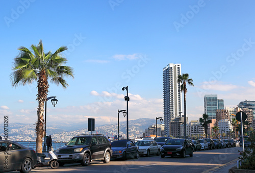 Beirut Corniche, view from the sea to the snow covered mountains photo