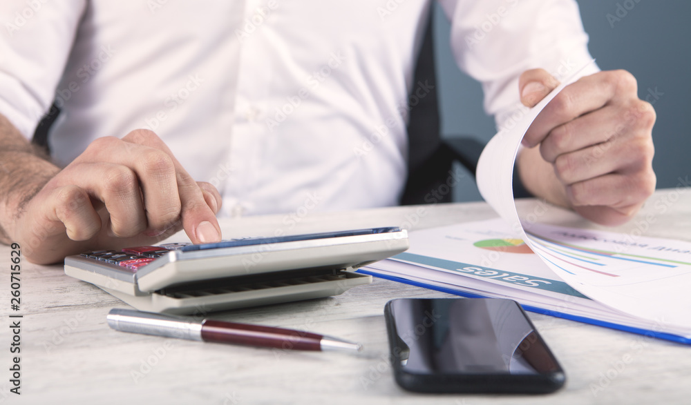 businessman calculator and tax