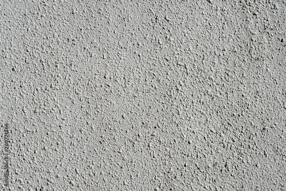 Plain gray textured plastered wall. Rough textured background of wall with copy space for text Plain gray textured plastered wall. Rough textured background of wall with copy space for text