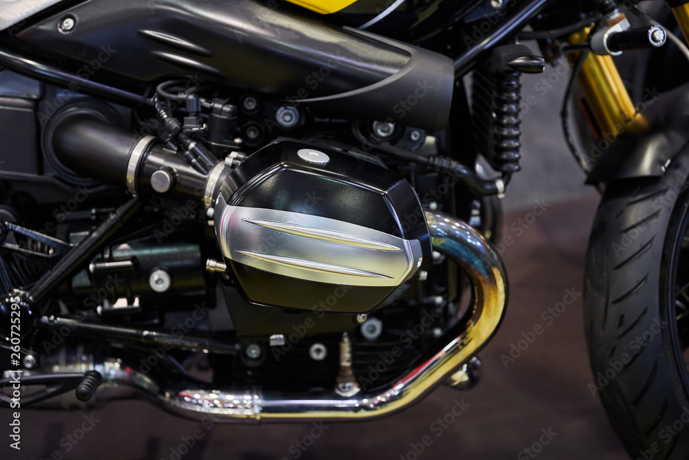 Fototapeta premium The powerful engine of a modern motorcycle closeup. The layout of the motor