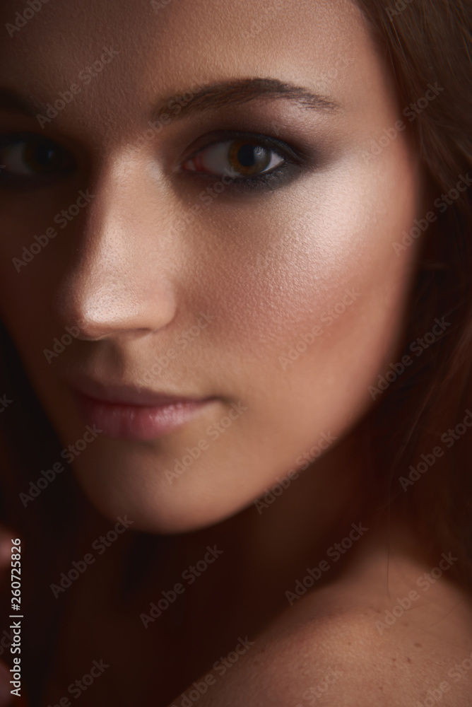 Obraz premium Gorgeous young woman with smokey eyes makeup