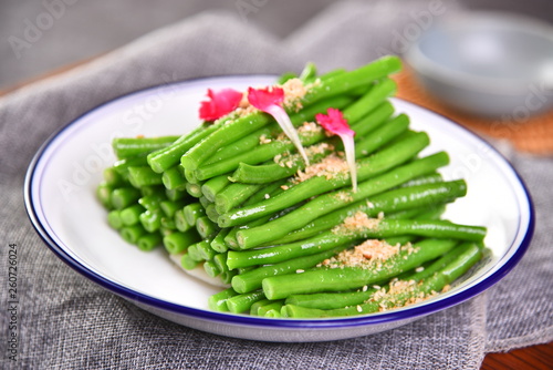fresh green asparagus in a white bowl