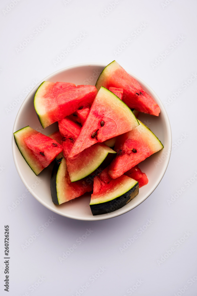 Watermelon / tarbooj fruit cube slices served in a bowl. selective focus Watermelon / tarbooj fruit cube slices served in a bowl. selective focus
