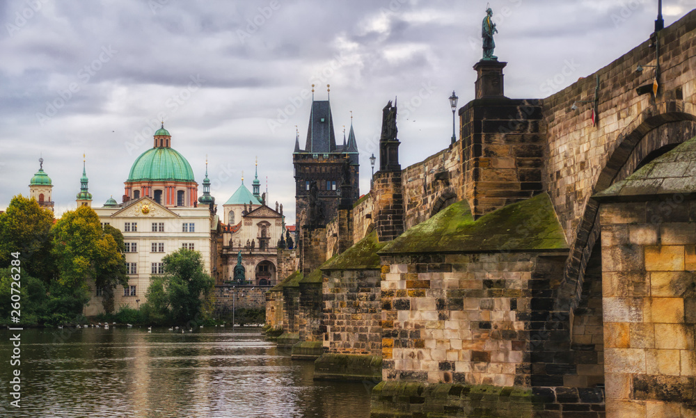 Scenic spring view of the Old Town pier architecture and Charles Bridge over Vltava river in Prague, Czech Republic