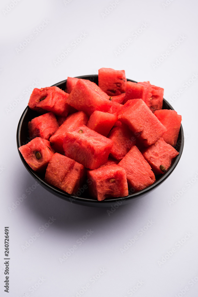 Watermelon / tarbooj fruit cube slices served in a bowl. selective focus Watermelon / tarbooj fruit cube slices served in a bowl. selective focus