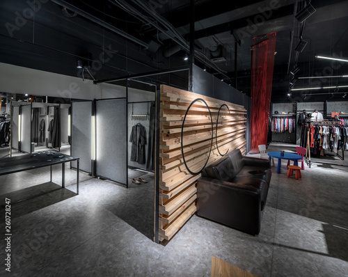 Quadro em tela Modern clothes shop with large selection of different wear and shoes