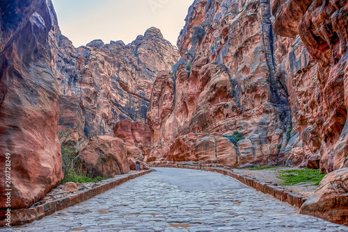 narrow passage in the canyon al-Siq in the mountains leading to the ancient Nabatian city of Petra photo