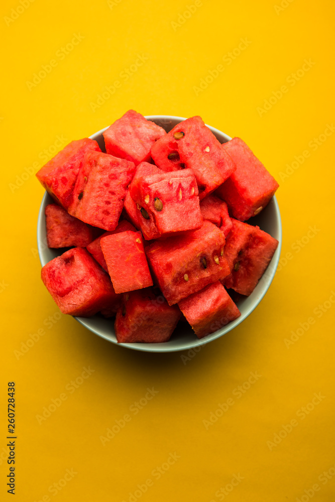 Watermelon / tarbooj fruit cube slices served in a bowl. selective focus Watermelon / tarbooj fruit cube slices served in a bowl. selective focus