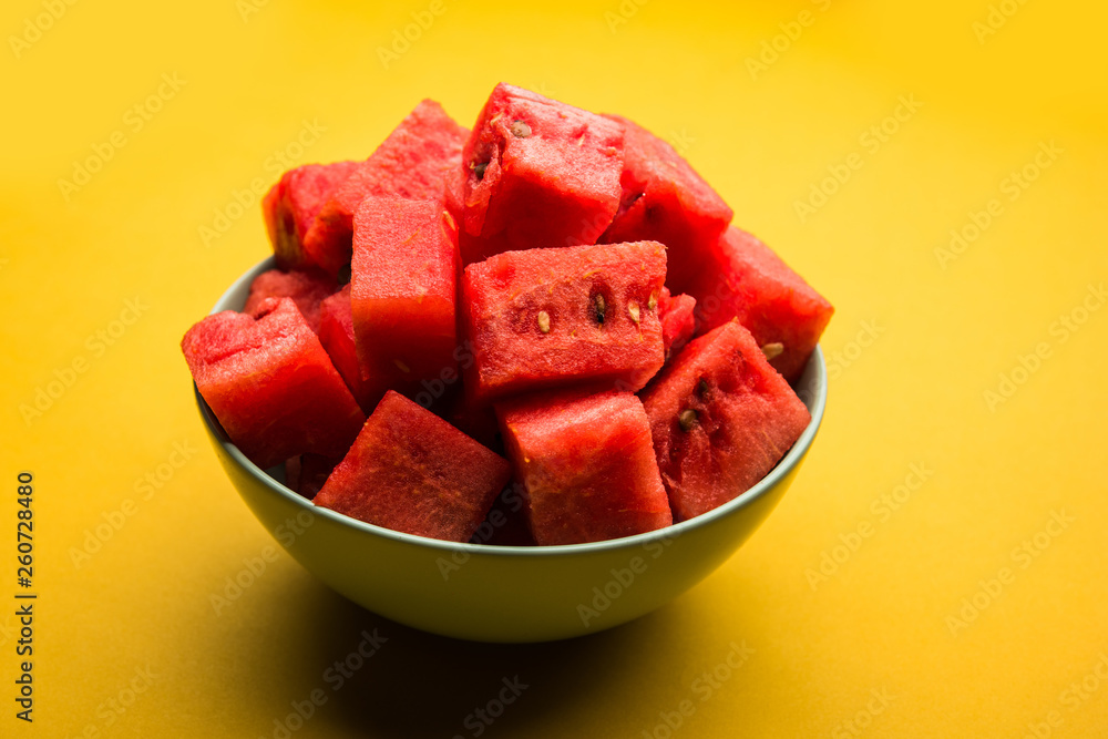 Watermelon / tarbooj fruit cube slices served in a bowl. selective focus Watermelon / tarbooj fruit cube slices served in a bowl. selective focus