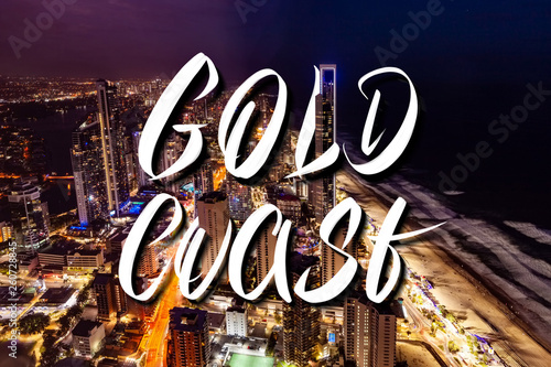 Gold Coast hand lettering over Surfers Paradise city skyline at night in Queensland, Australia