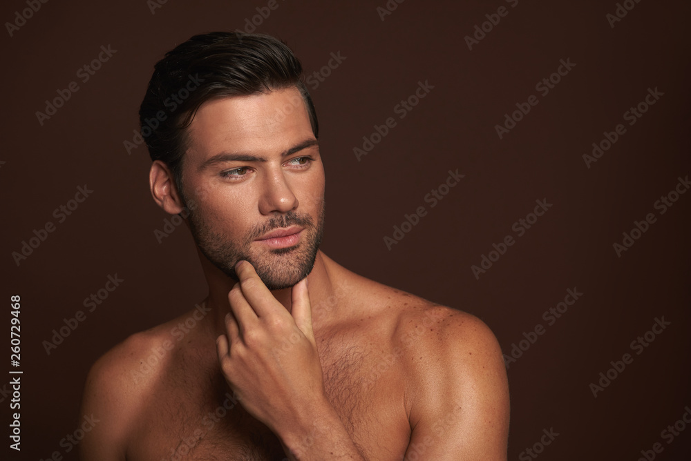 Fototapeta premium Portrait of sexy muscular man with gentle bristle