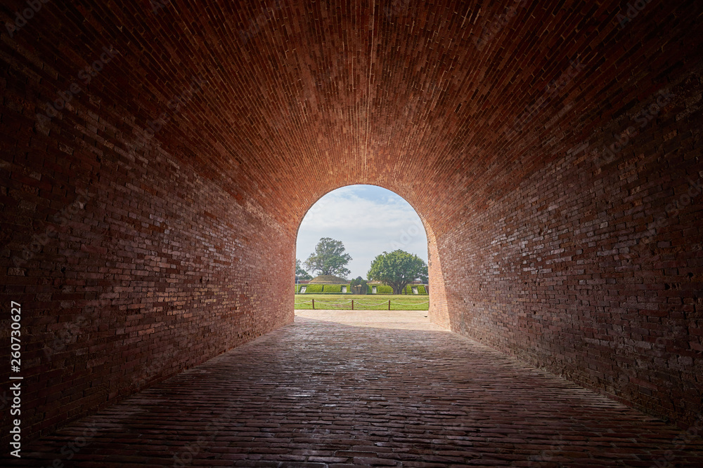 Beautiful red brick tunnel scenic of the Eternal golden castle. Ruins of a defensive castle built with cannon in Tainan city, Taiwan.