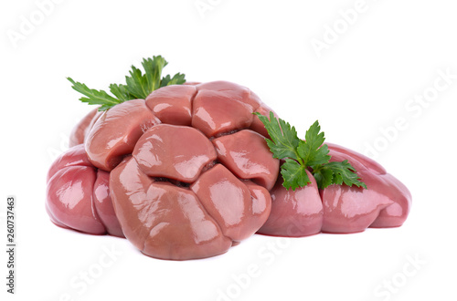 Beef kidney raw isolated on white background. Close Up. Cow kidney isolated with parsley leaves. photo